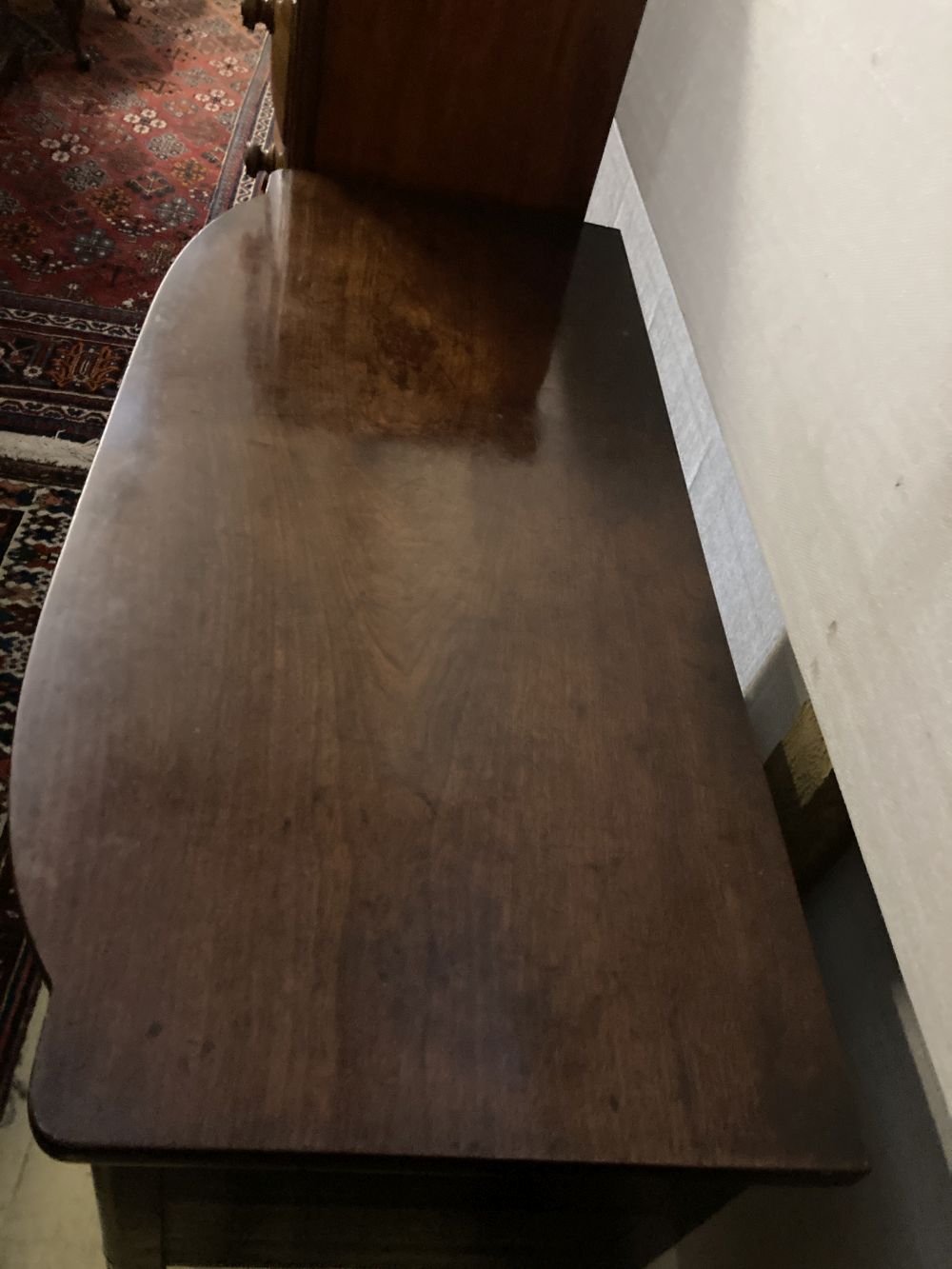 A Regency ebony inlaid mahogany bow front sideboard, width 122cm, depth 57cm, height 89cm